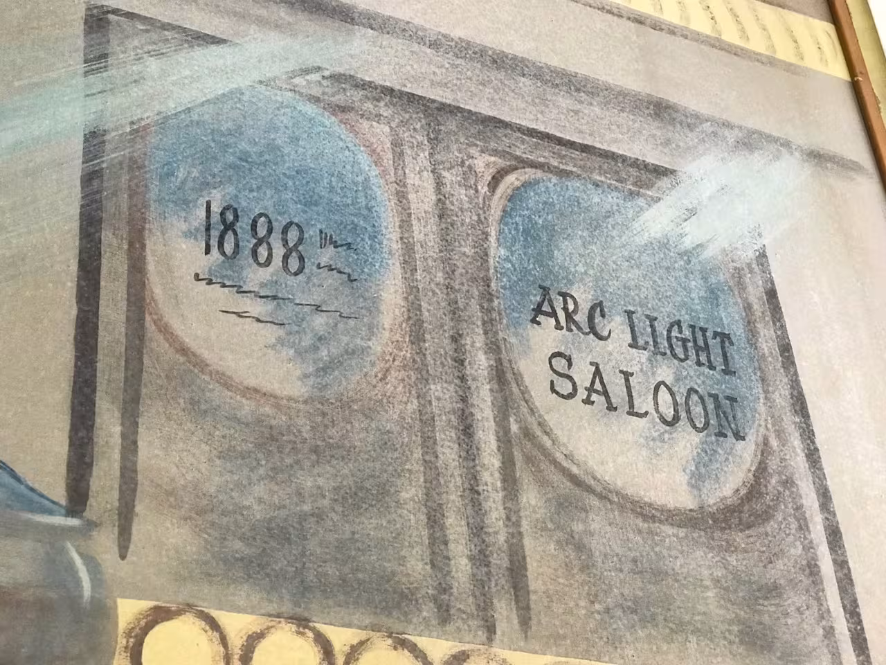 The doors on the mural inside the Heritage Haus clock shop that historically was the location of the original Arc Light Saloon.